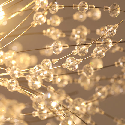Delphine firework crystal chandelier – lit crystals with a warm glow