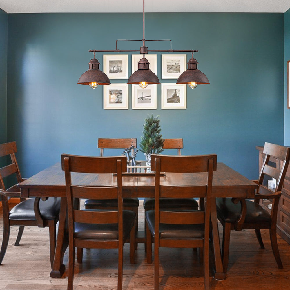 Benedict 3-light linear dome pendant – over a dining table with a blue wall