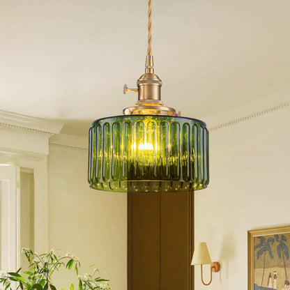 Juliette ribbed glass drum pendant light – in green glass in a hallway