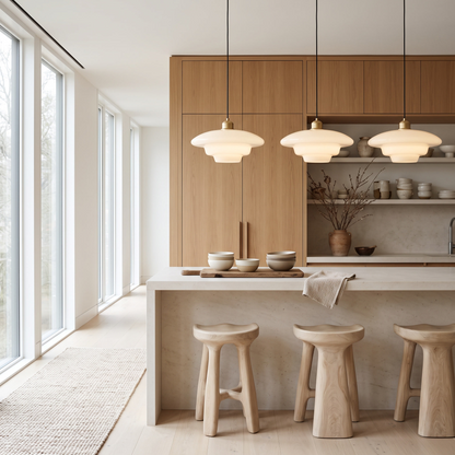 Three Brassa pendant lights above a kitchen island