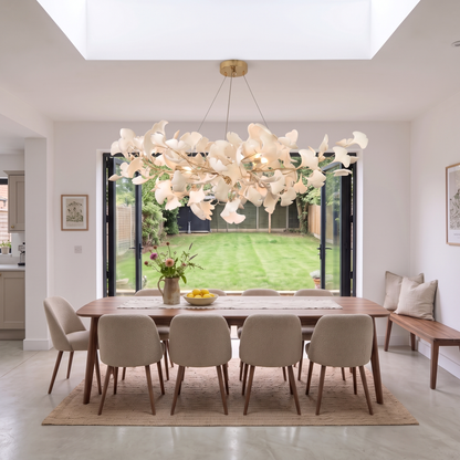 Gold Seraphina chandelier over a walnut dining table