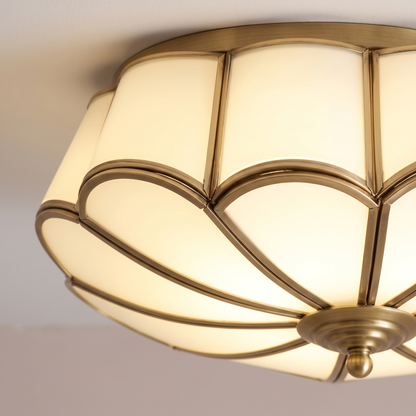 Close-up of Rosalind opal glass petals and brass ribs, lit