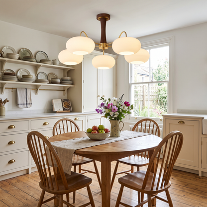 Cassius chandelier over a round oak dining table