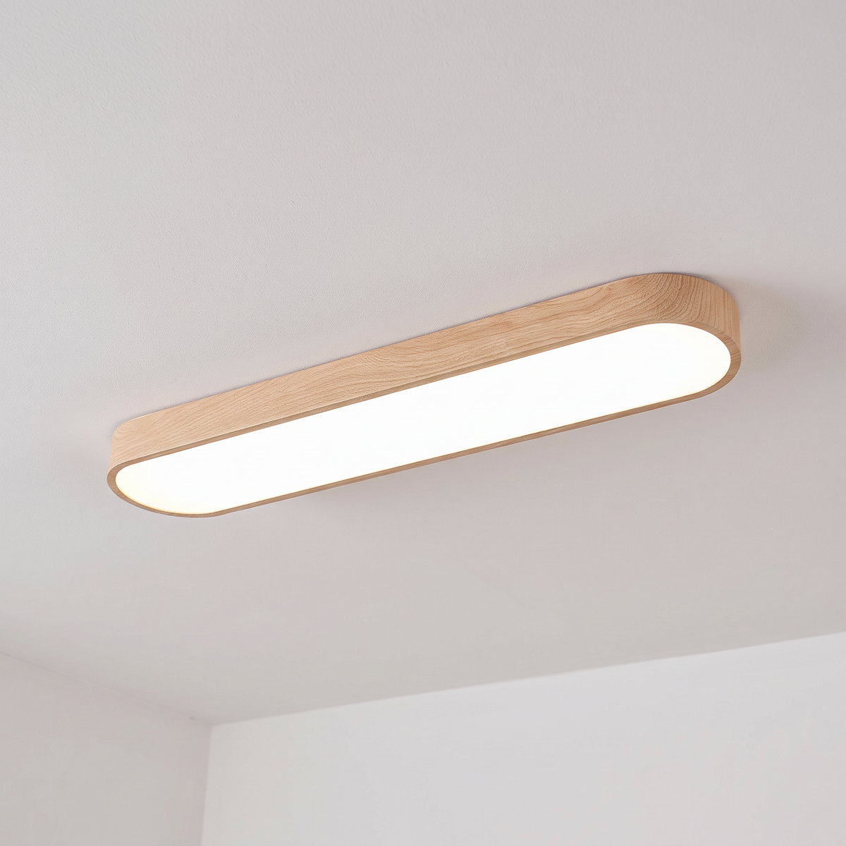 Elodie oval ceiling light, light brown wood-grain, cool white light