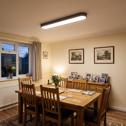 Elodie dark wood oval ceiling light above a dining table