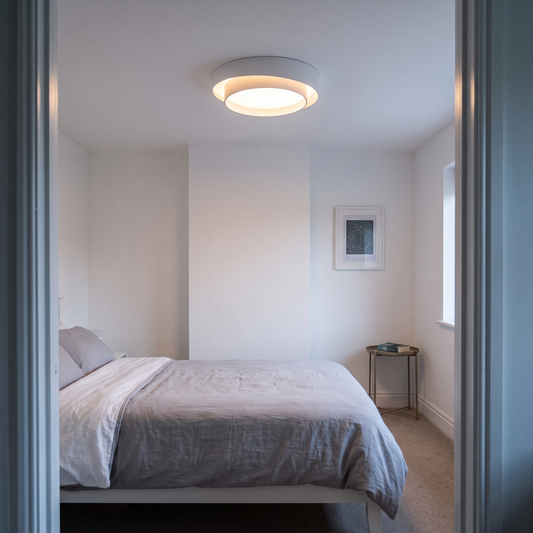 Aurora concentric ring ceiling light – glowing on a bedroom ceiling