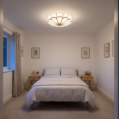 Rosalind glass flower ceiling light – glowing on a bedroom ceiling