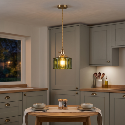 Juliette green ribbed glass pendant – glowing above a bistro table