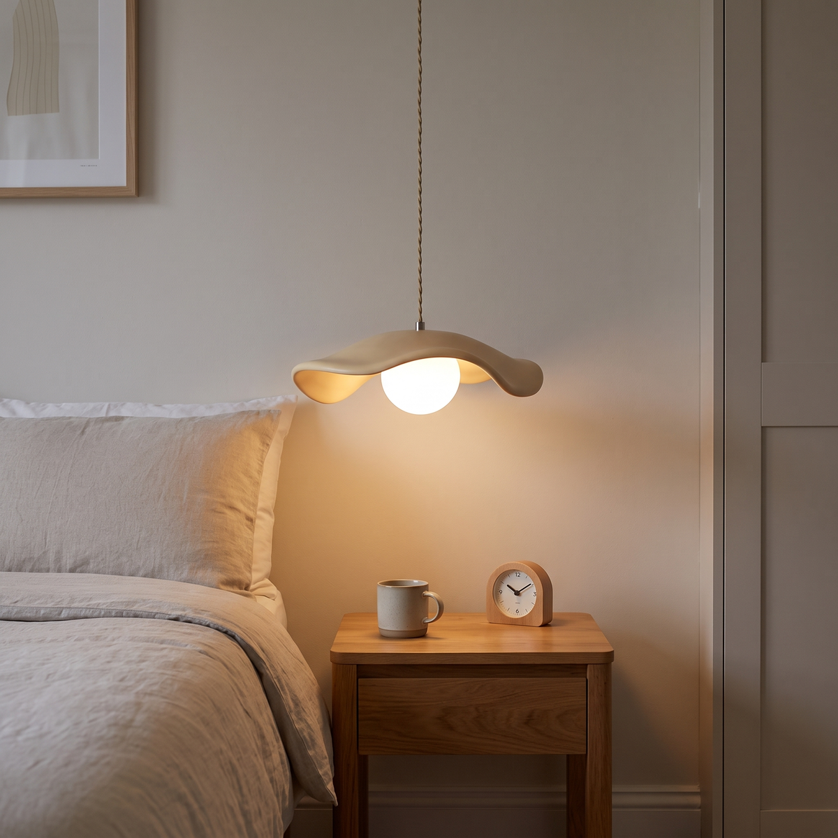 Giselle wavy resin pendant – glowing beside a bed