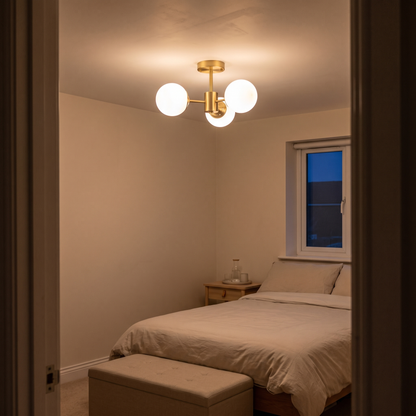 Gabriella brass sputnik ceiling light – glowing in a bedroom