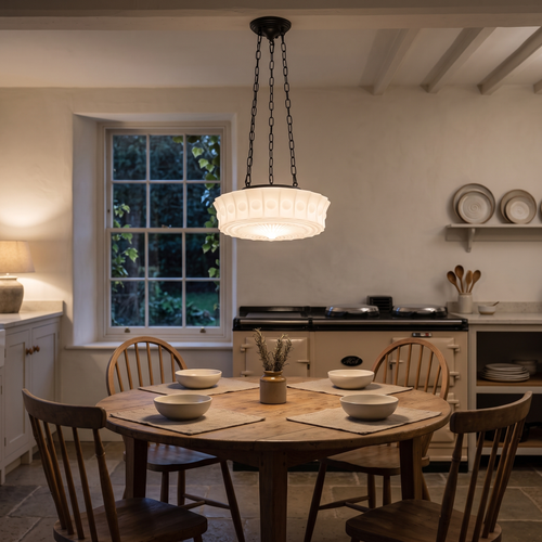 Adrian fluted schoolhouse pendant – glowing above a kitchen table
