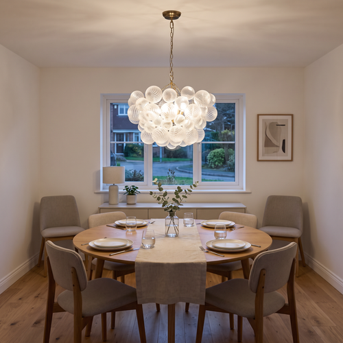 Annika ribbed glass bubble chandelier – glowing above a dining table
