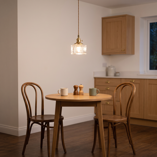 Odette rippled glass pendant – glowing above a bistro table
