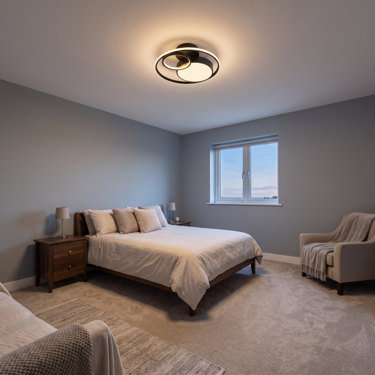Elowen double ring LED ceiling light – glowing in a bedroom