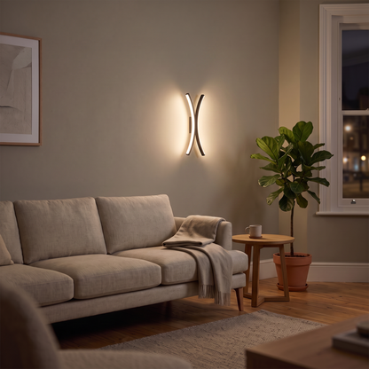 Blythe curved LED wall light – glowing in a living room