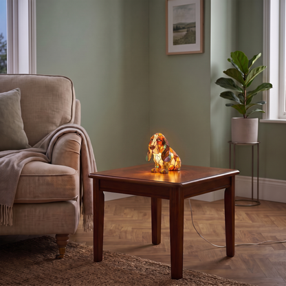 Wilfred dog figurine lamp – glowing on a side table