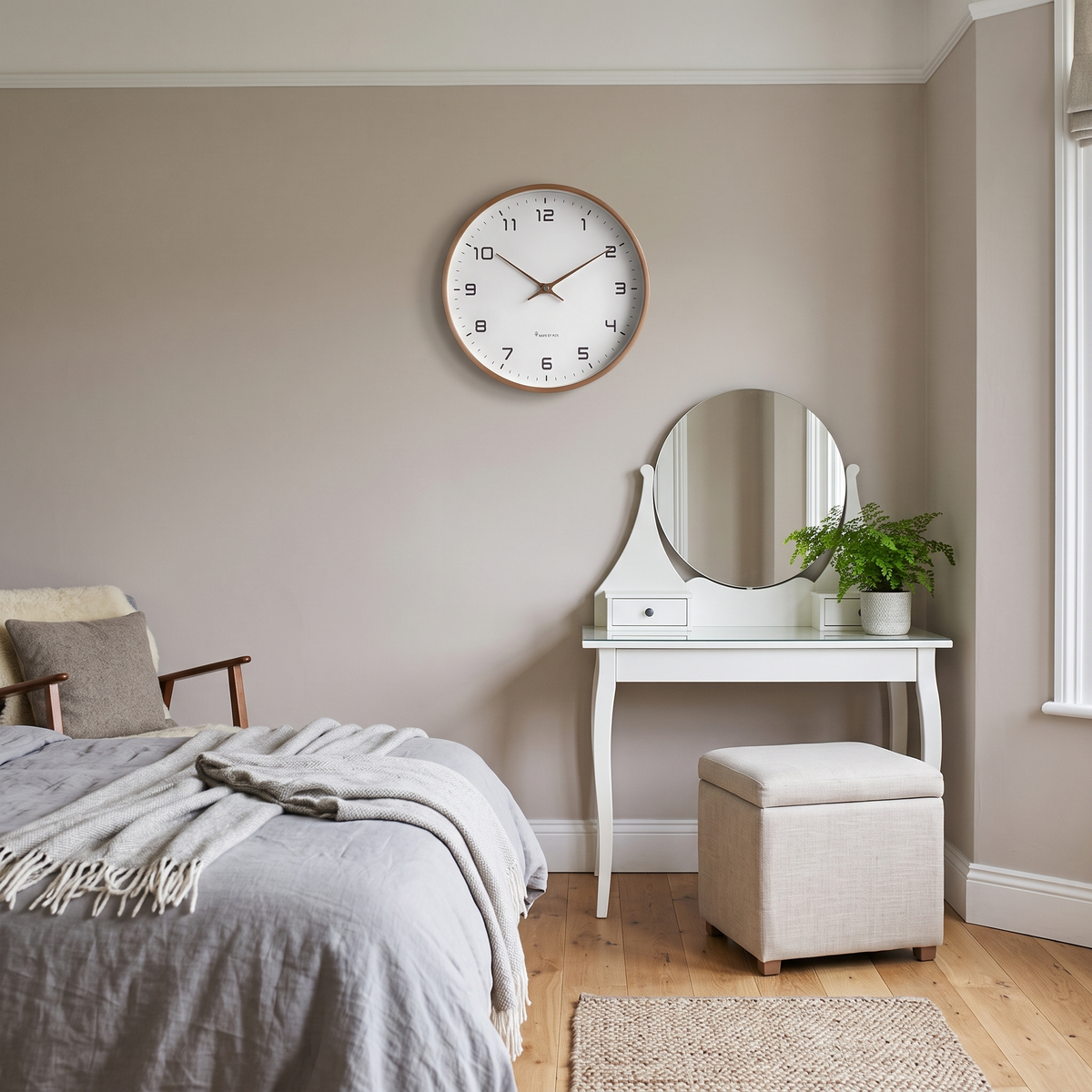 Melisande round wall clock – above a dressing table
