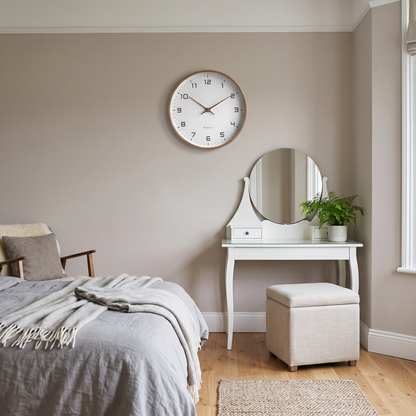 Melisande round wall clock – above a dressing table