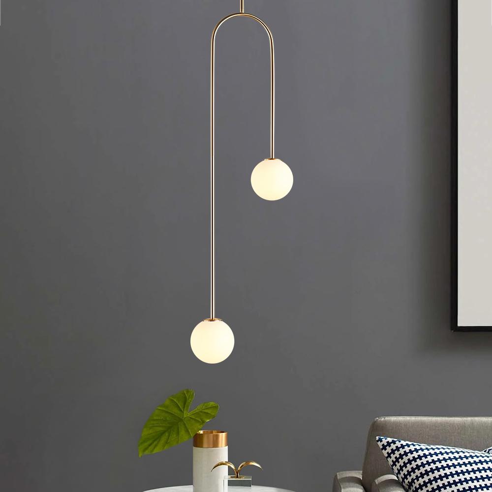 Mirabel twin globe pendant light – against a dark grey wall