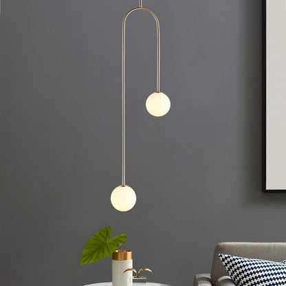 Mirabel twin globe pendant light – against a dark grey wall