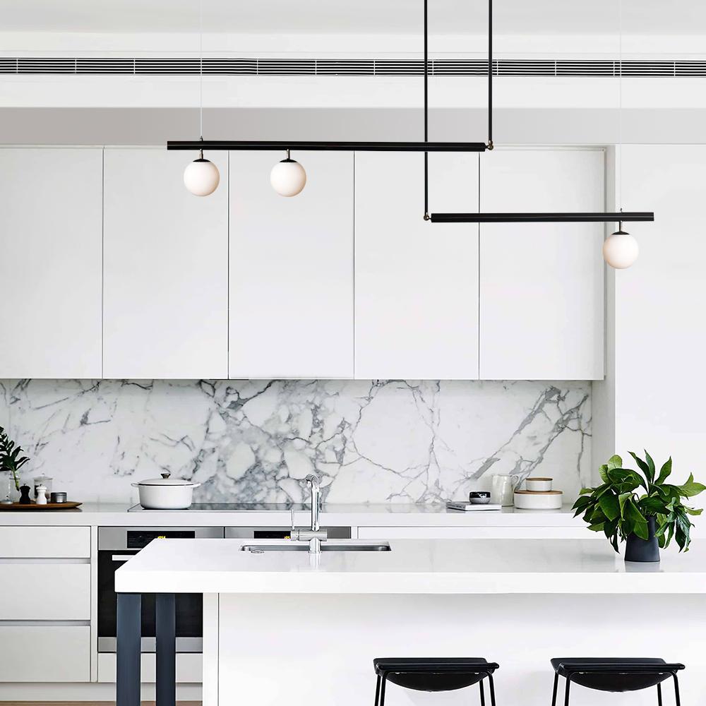 Vittoria linear chandelier – in black over a white kitchen island