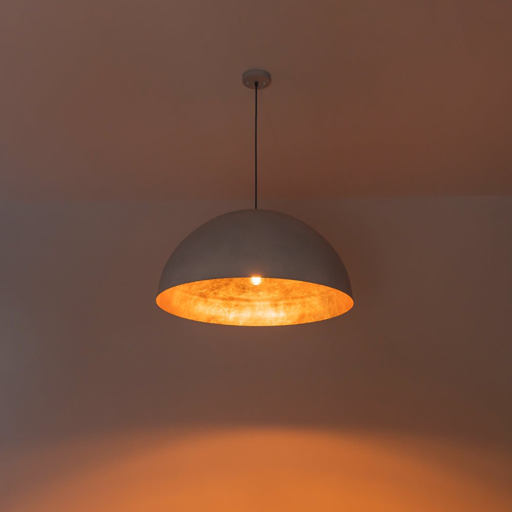 Octavia oversized dome pendant – lit with a warm glow