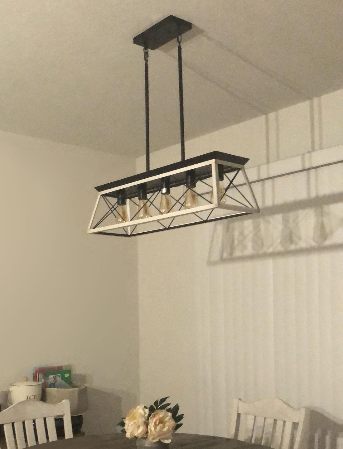 Lysander linear chandelier – over a table in a bright room