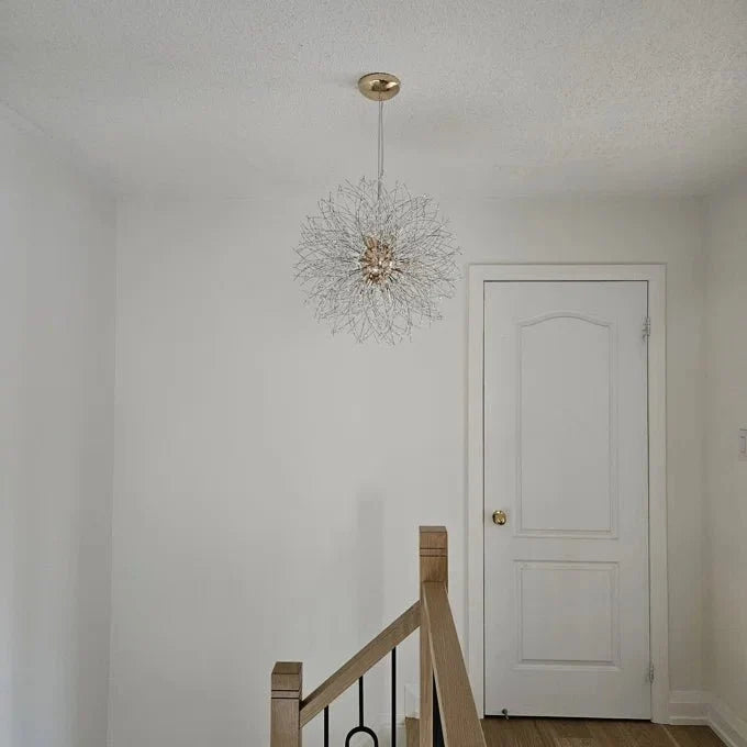 Delphine firework crystal chandelier – in a hallway above stairs