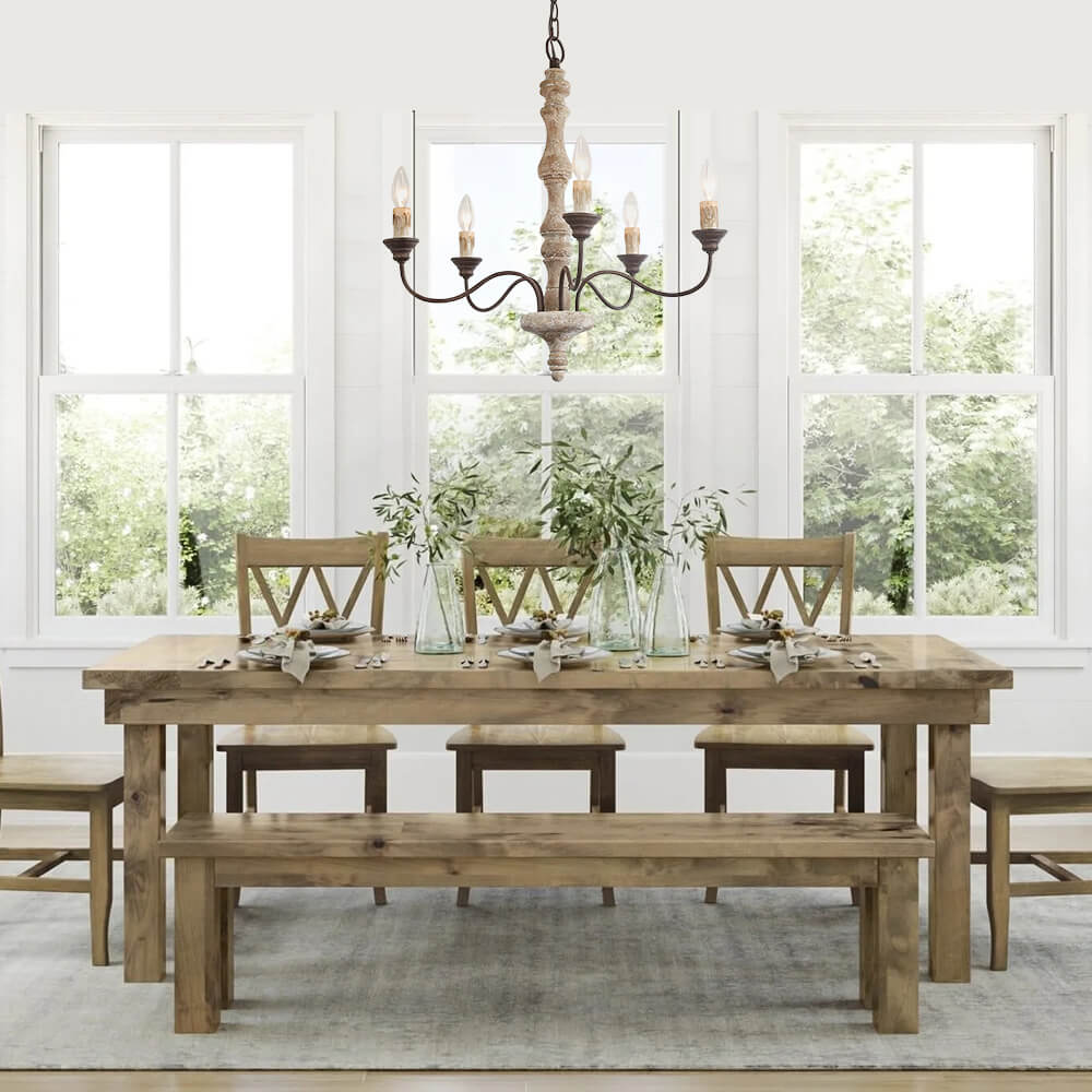 Amalia rustic candle chandelier over a farmhouse dining table