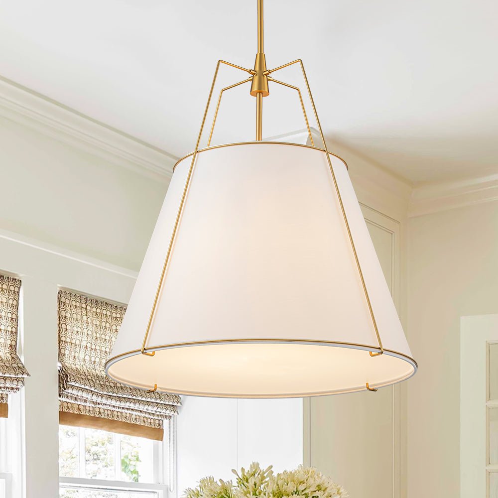 Ophelia tapered linen pendant – white shade with brass frame in a bright room