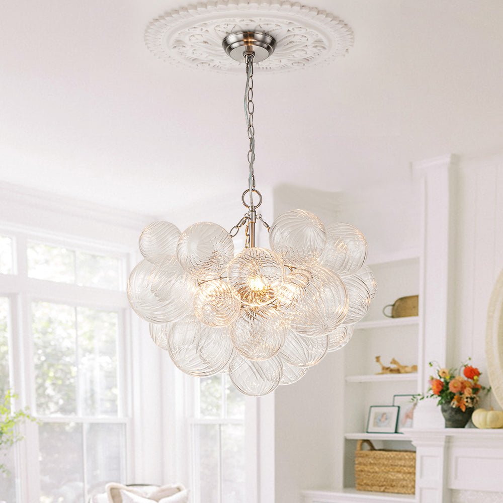 Annika bubble chandelier – in a white room with a ceiling medallion