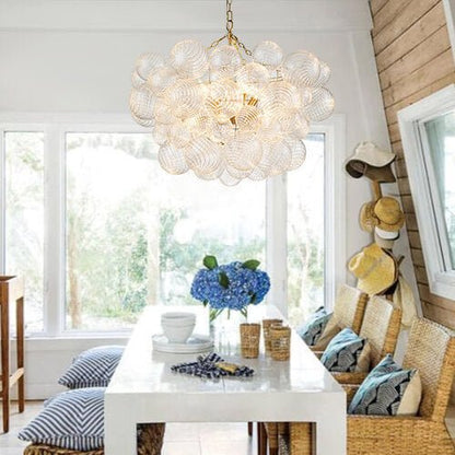Annika bubble chandelier – in a sunroom above a desk
