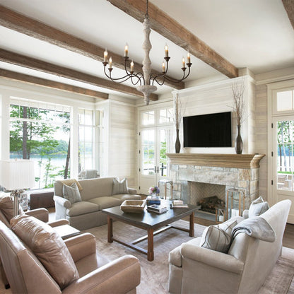 Amalia 8-light candle chandelier in a living room with wooden beams