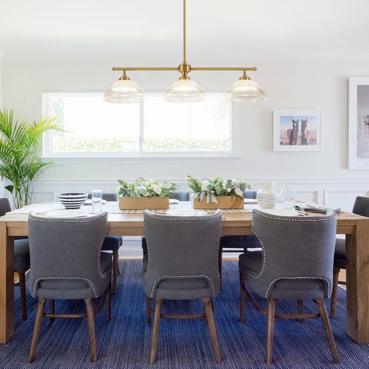 Eleonora ribbed glass pendant light – 3-light version over a dining table