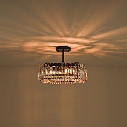 Tatiana crystal drum ceiling light – lit with a warm glow