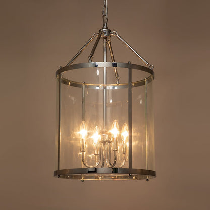 Tristan glass lantern chandelier – lit in a warm room