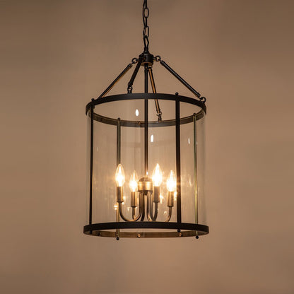 Tristan glass lantern chandelier – lit on a warm background