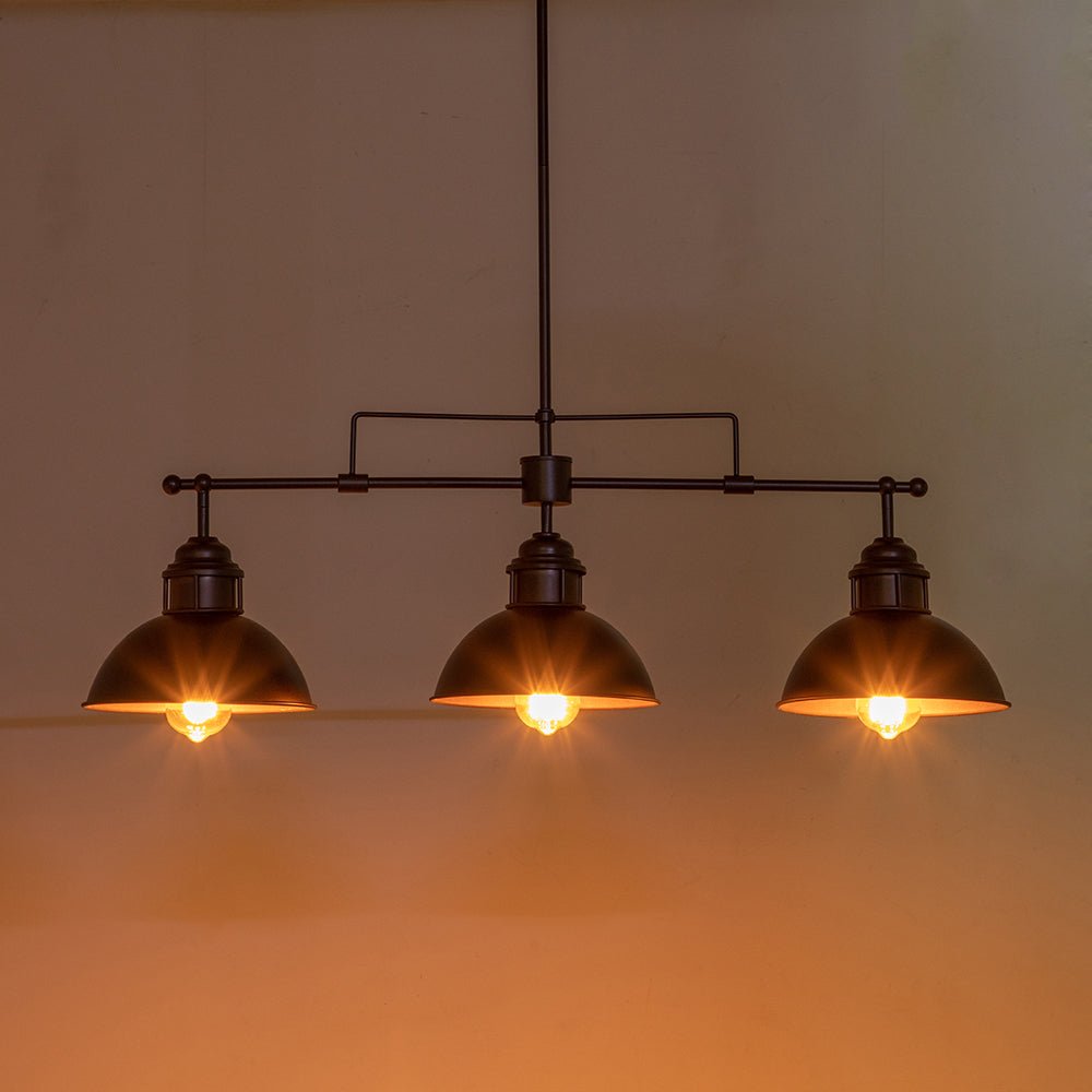 Benedict 3-light linear dome pendant – lit with a warm glow