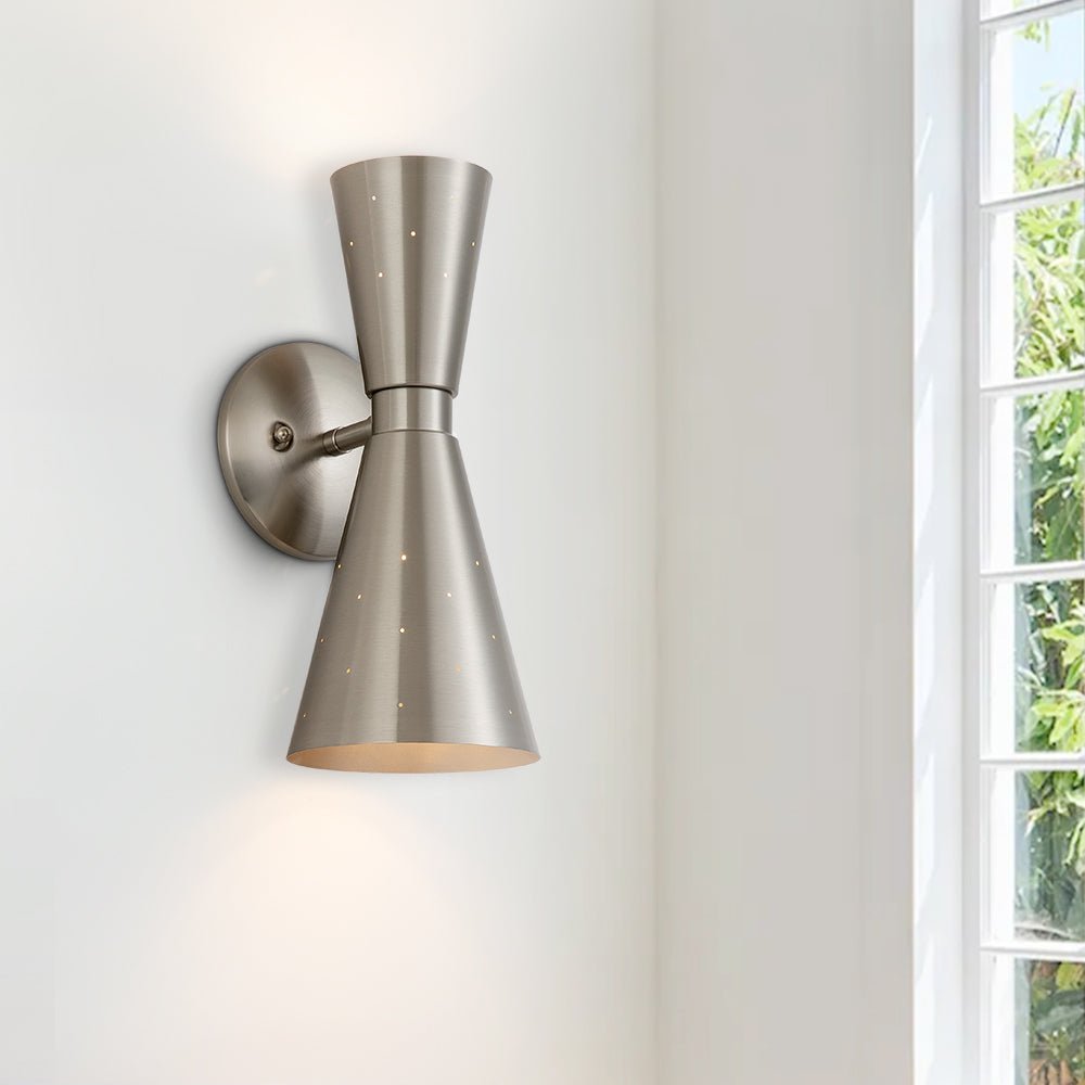 Stellan hourglass wall light – in nickel in a room
