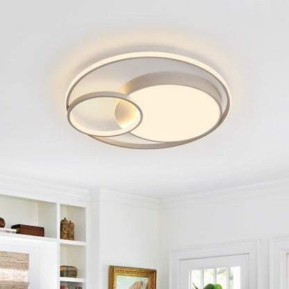 Elowen double ring LED ceiling light – in white, lit in a living room