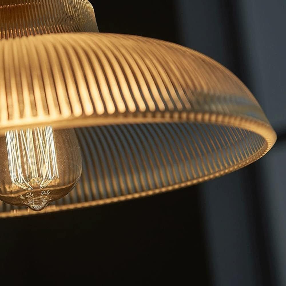 Estella ribbed glass pendant – lit shade against a dark background