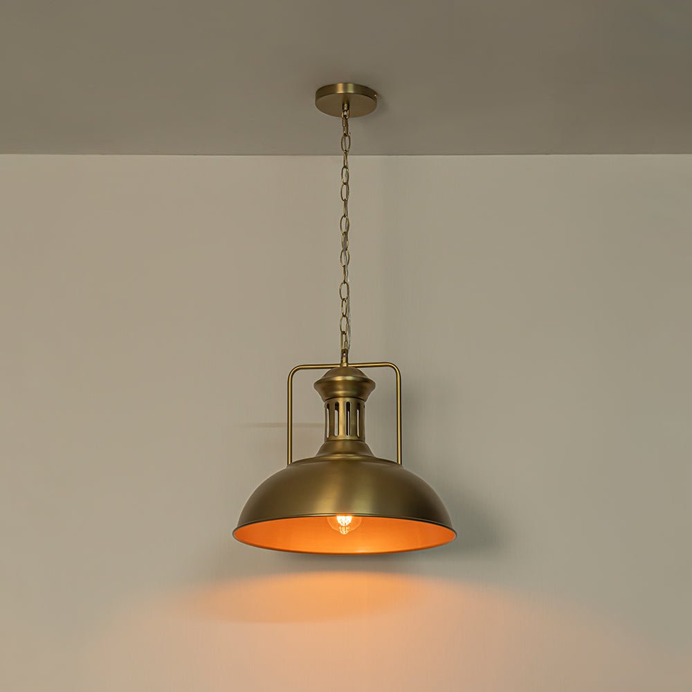 Leopold metal dome pendant light – in gold with a warm glow