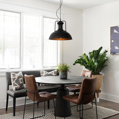 Hugo black dome pendant light over a round dining table