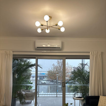 Marcel 6-light sputnik ceiling light – in a living room with windows