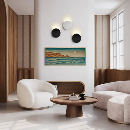 Camille round LED wall light – pair in a living room