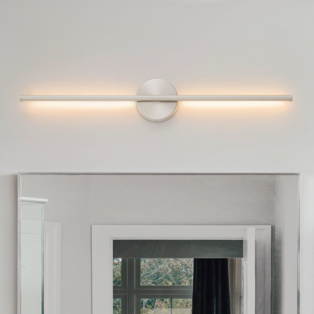Sebastian linear LED wall light – horizontal, lit above a fireplace