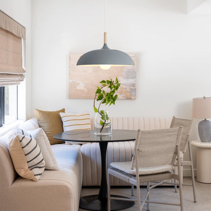 Romilly dome pendant – in black over a dining table