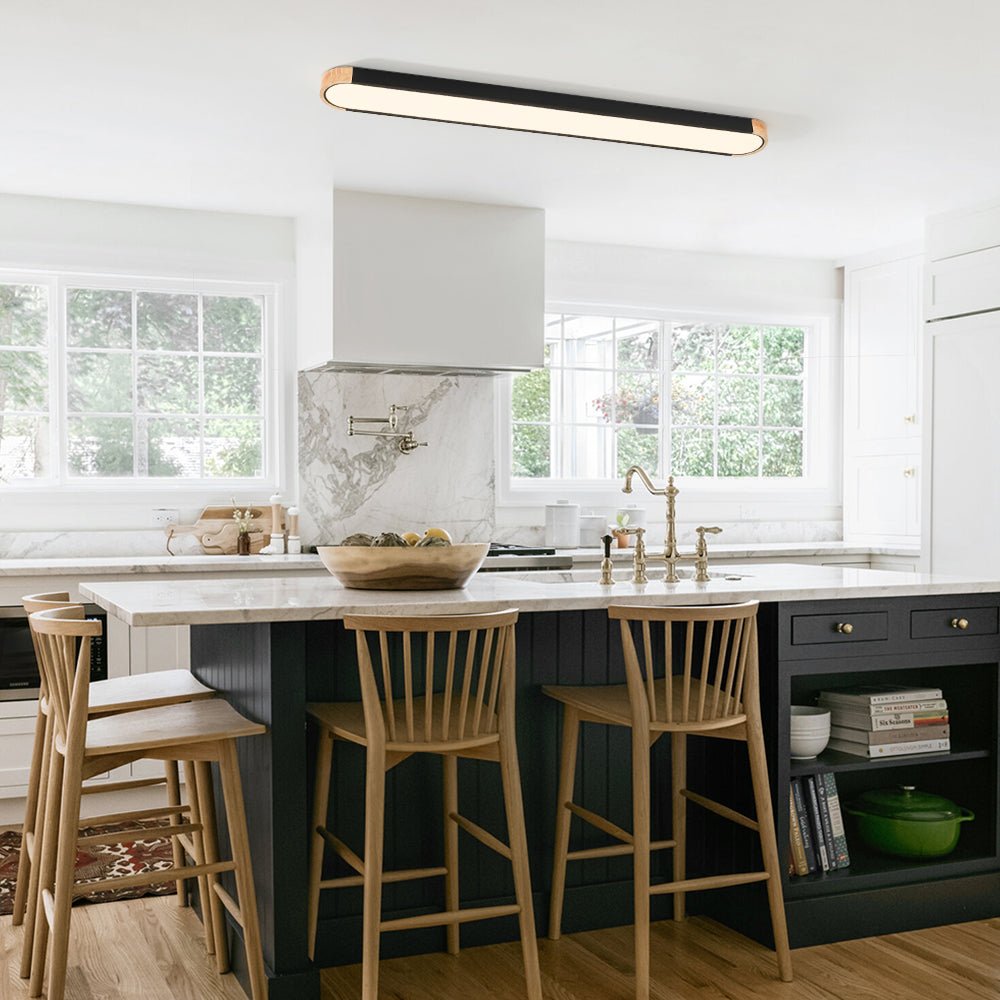 Imogen black 122 cm oval LED ceiling light above a kitchen island