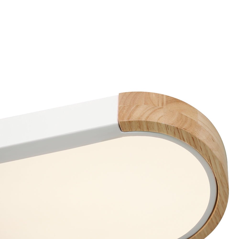 Close-up of the Imogen oak wood end cap and frosted diffuser