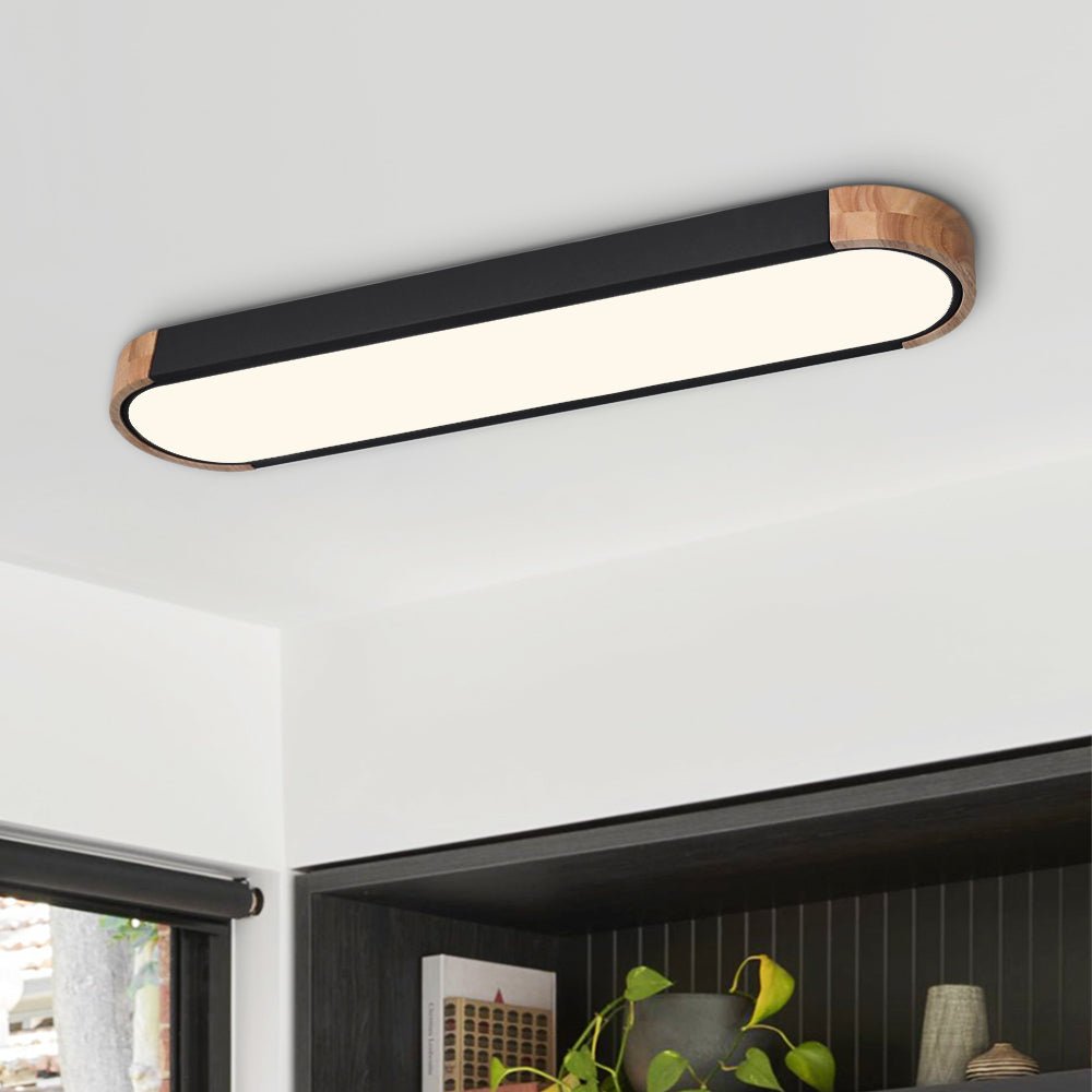 Imogen black oval LED ceiling light in a modern room